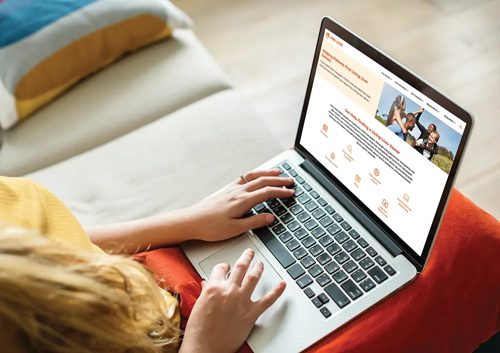 A person looking at the Find a Liver homepage on a laptop